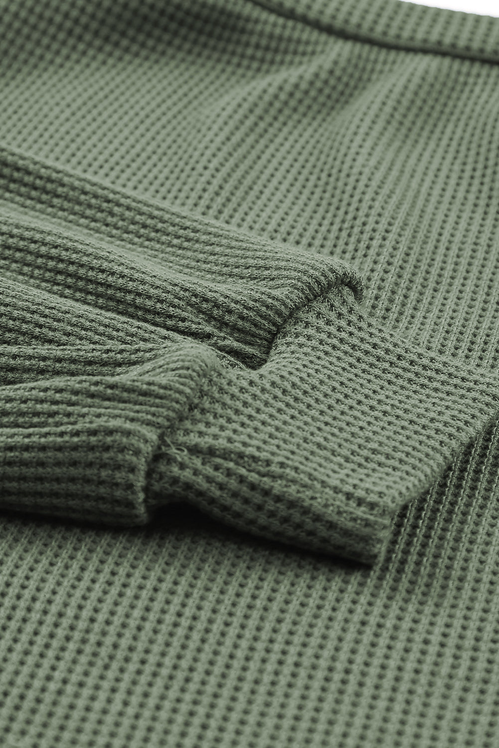 Haut en tricot gaufré vert à col rond et manches bouffantes