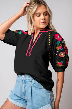 Black textured blouse with puffy sleeves and Ricrac floral embroidery