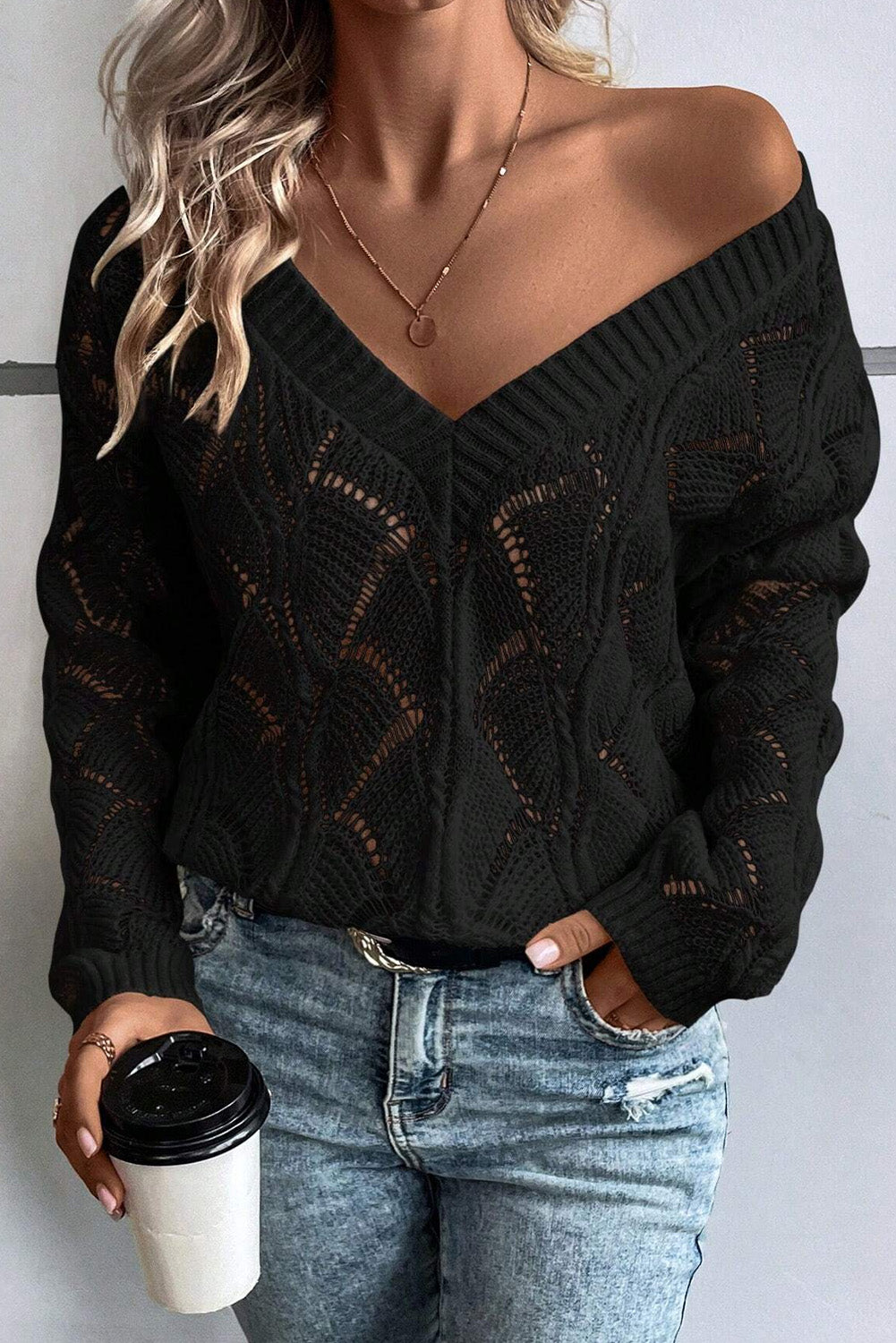 Black openwork knit sweater with V-neck and dropped shoulders