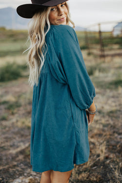 Blue sleeve dress and ribbed velvet bracelet with press pimples and empire waist