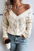 Pull beige en tricot ajouré à col en V *