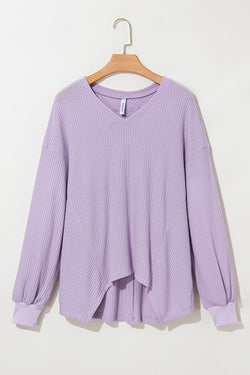 Ample blouse with embossed orchid petals, V -neck, long sleeves, falling shoulders