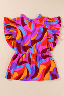 Orange peplum blouse with abstract print and floating sleeves