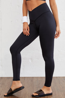 Leggings activos sin costura negra con tamaño arqueado