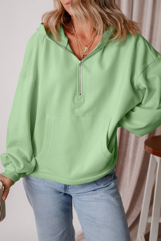 Loose fitting half zip hoodie with kangaroo pockets lined with smoke green fleece