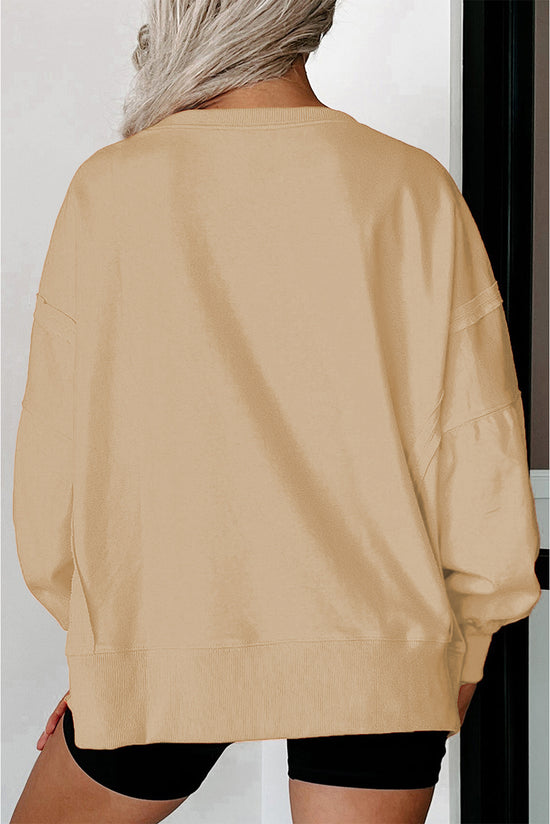 Light French beige beige sweatshirt, drooping shoulders, round neck and slits