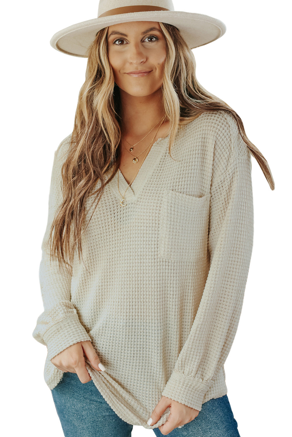 Top holgado con bolsillos y cuello dividido de punto tipo gofre en beige