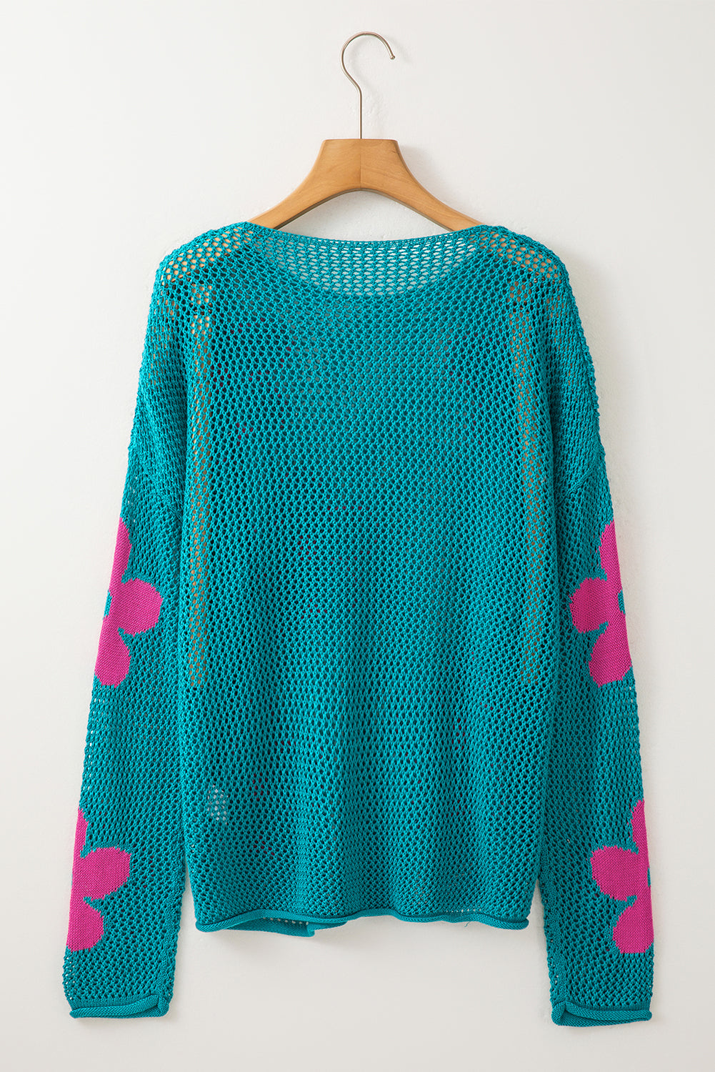 Dropped shoulder sweater in openwork knit with large sea green flower