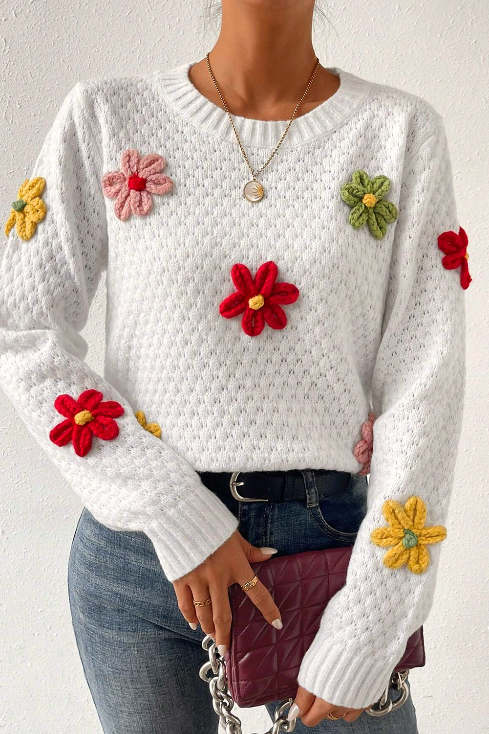 Textured knit sweater with white colorful flower appliques