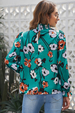 Smoked blouse with an upright collar and floral print