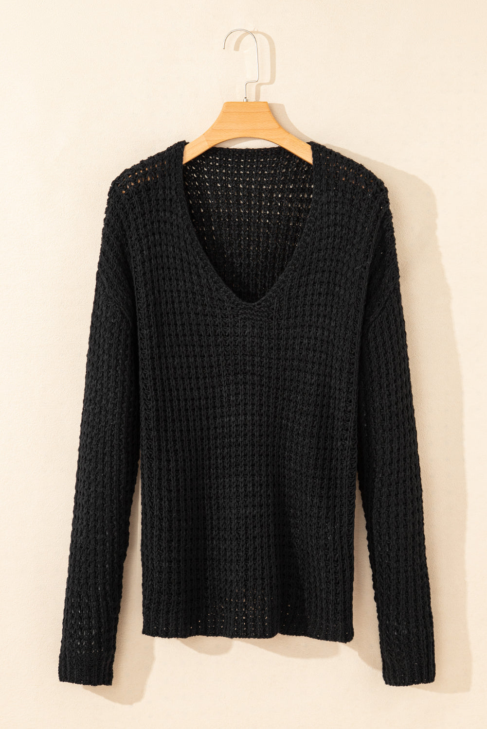 Black V-neck sweater with openwork crochet