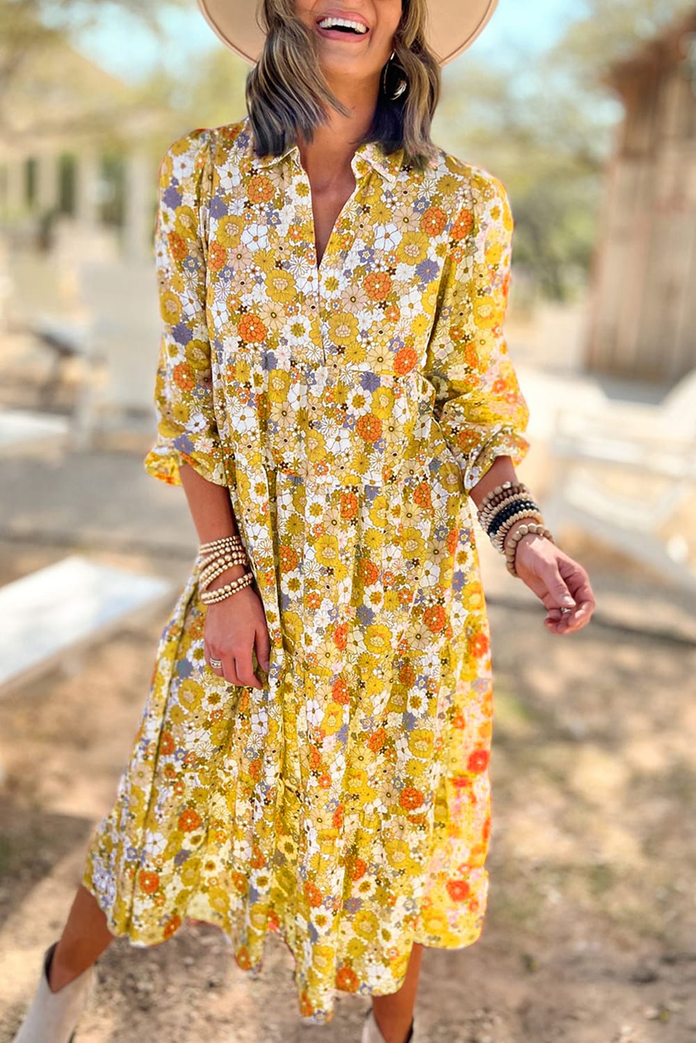 Yellow ruffled dress with long sleeves and floral collar in bohemian style