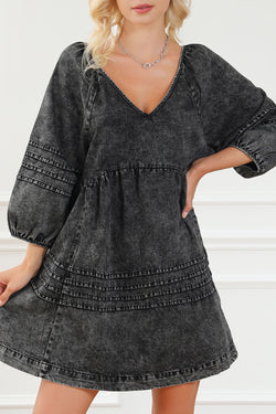 Black pleated denim babydoll dress with v-neck and puff sleeves