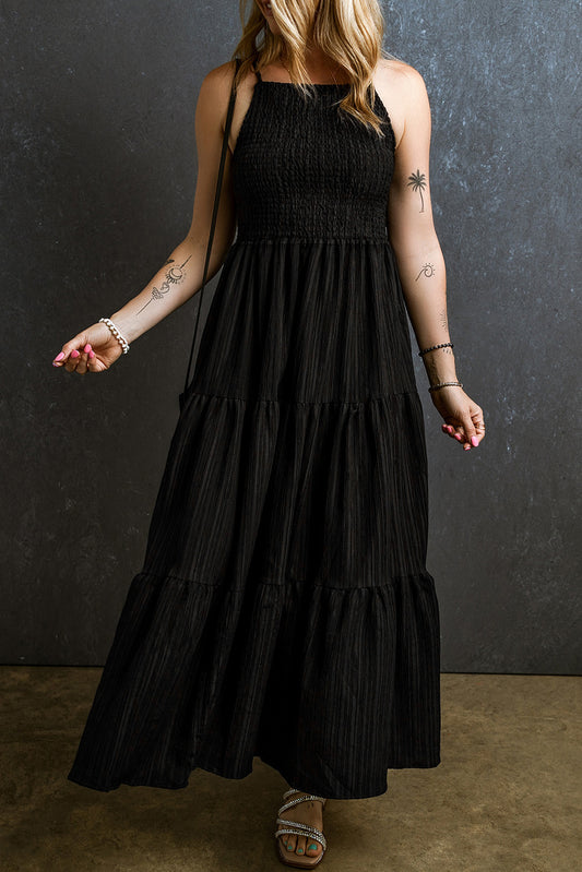 Black long dress with ruffles and spaghetti straps, smocked and pleated