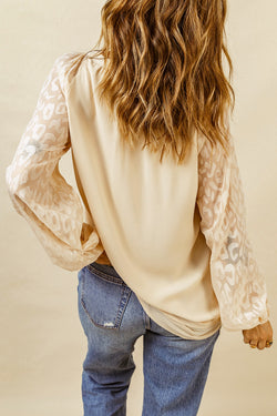 Beige blouse with split neck and puffy sleeves in leopard mesh