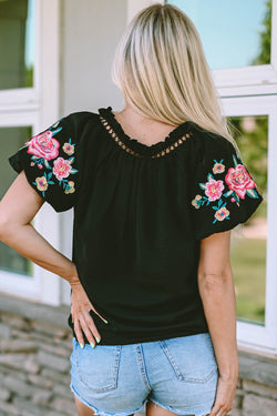 Black high with V -neck and puffy sleeves embroidered with flowers