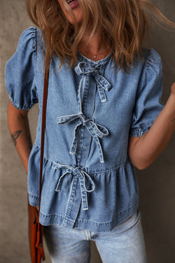 Twilight blue denim shirt tied on the front with bubble and basque sleeves