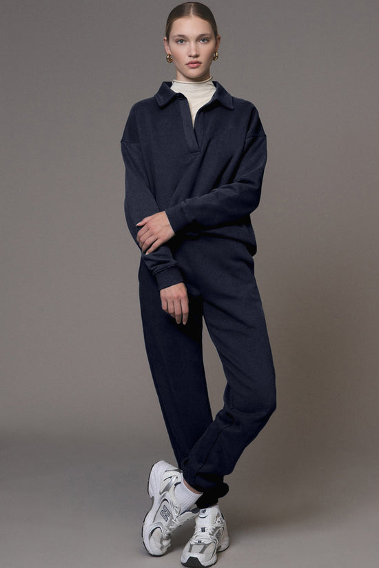 Swears and navy blue jogging sweater and pants in folded collar