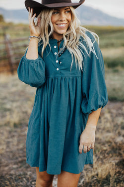 Blue sleeve dress and ribbed velvet bracelet with press pimples and empire waist