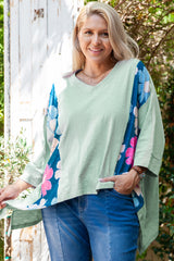 Large top green top in patchwork of flowers