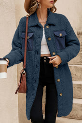 Blue teddy coat with simple buttoning and contrasting flap pocket