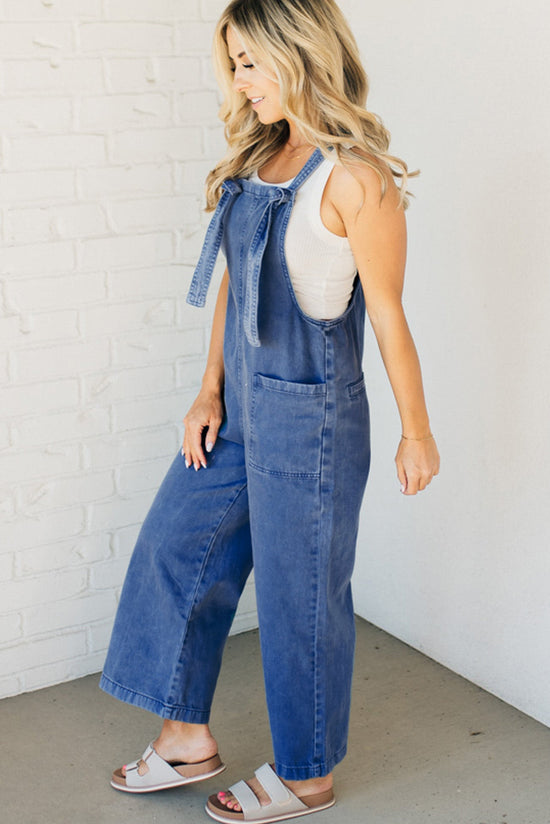 Blue Denim overalls of Prussia with knotted straps and pocket pocket, wide leg