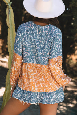 Orange blouse with flowers and color blocks *