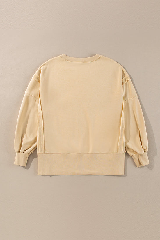 Light French beige beige sweatshirt, drooping shoulders, round neck and slits