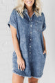 Mineral washed -out blue denim dress with reverse sleeves and effiloche hem