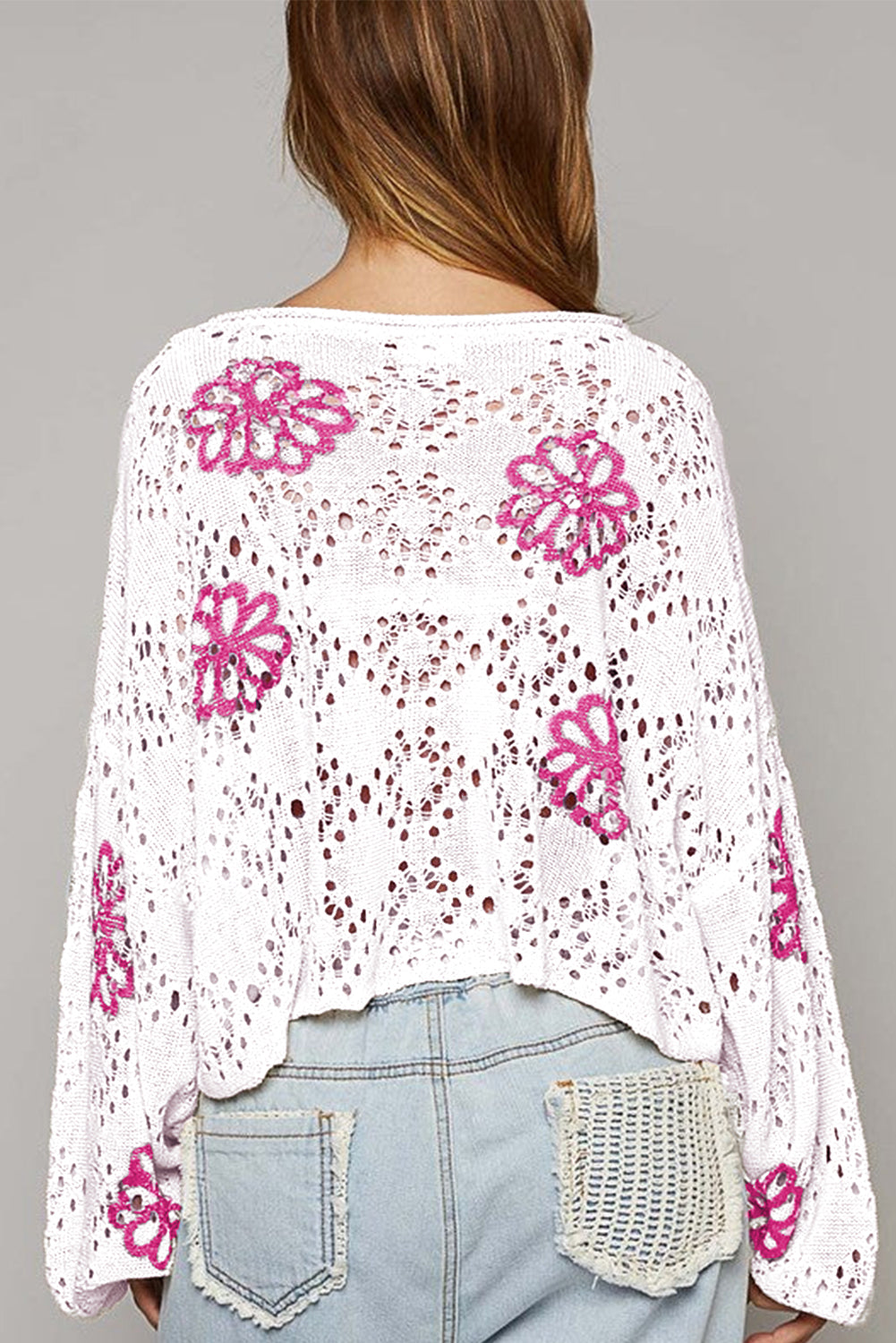 White drop shoulder sweater with contrast floral print eyelets