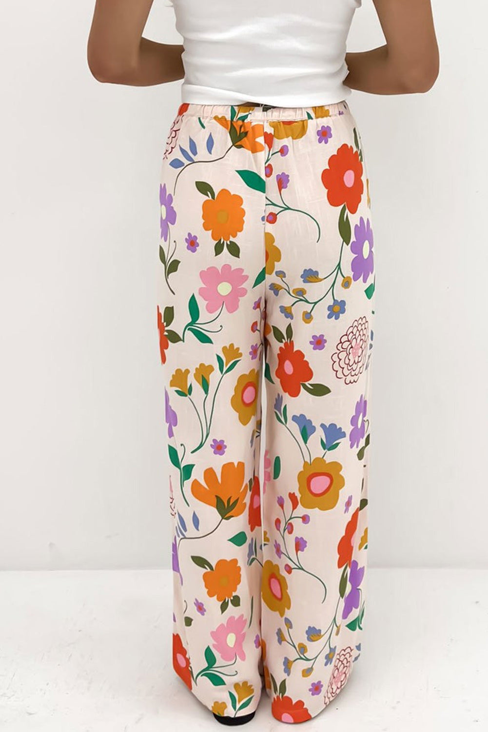 Pantalones sueltos con estampado floral naranja