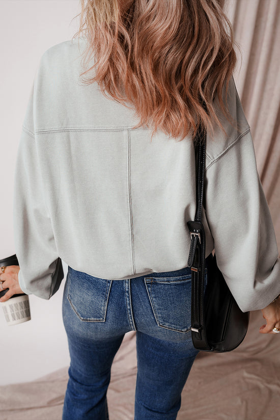 Grey sweatshirt with exposed seams, batwing sleeves and dropped shoulders