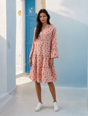 Orange floral print mini dress with ruffle sleeves and button front