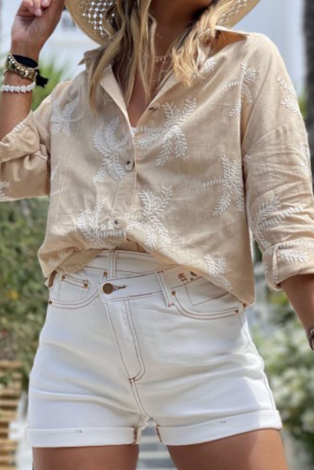 Stylish white denim shorts with asymmetrical waist