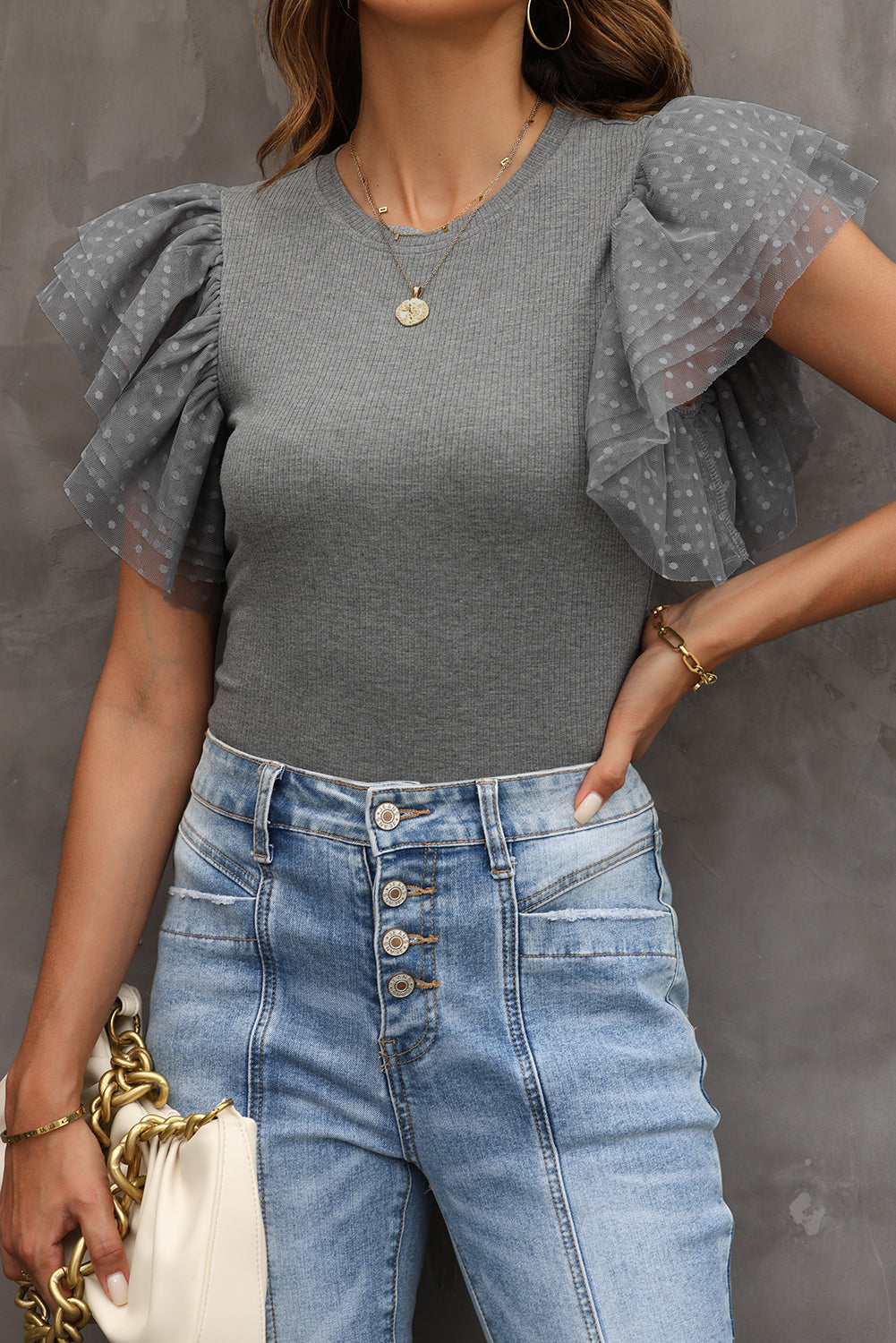 Gray ribbed knitting high with fluffy sleeves in polka dot mesh