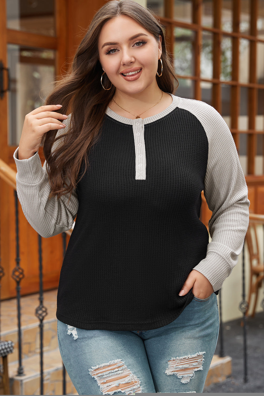 Large large size button in black contrasting knitting