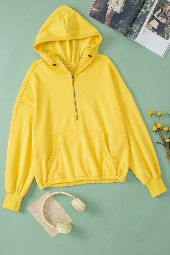 Sweat à capuche zippé jaune avec poche kangourou et bordure côtelée