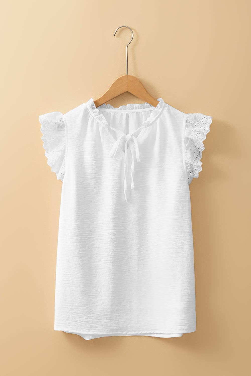 White textured blouse with embroidered ruffles *