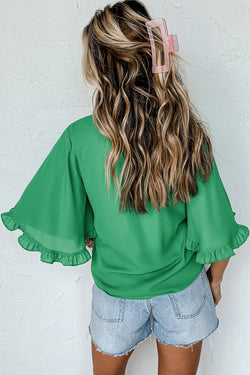 Green blouse with ruffles, round neck *