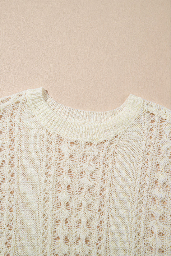 Pull blanc en tricot ajouré à manches bouffantes*