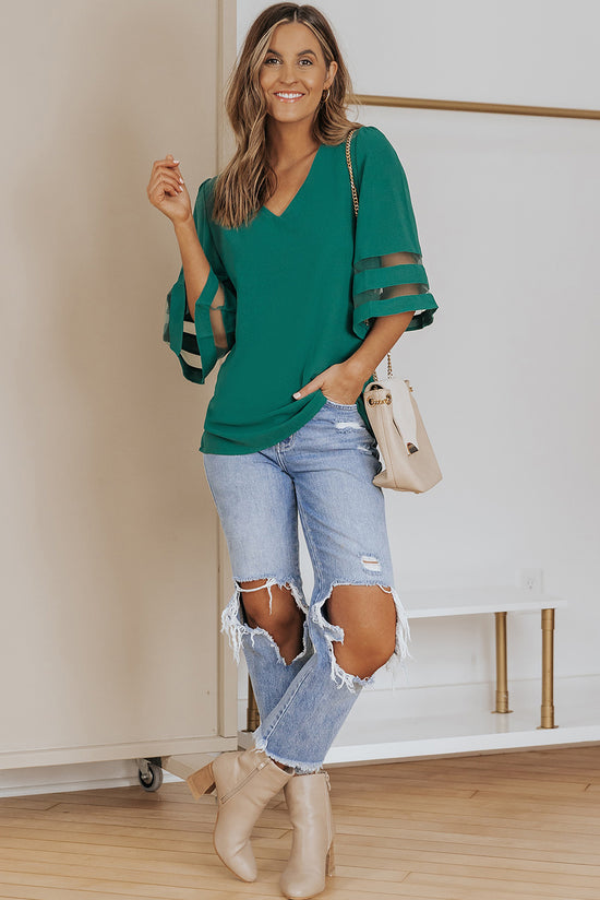 Green loose blouse with flared sleeve and v -collar