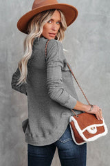 Grey waffle knit top with ribbed trim and crew neck