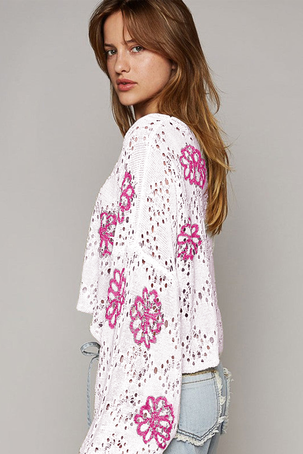 White drop shoulder sweater with contrast floral print eyelets