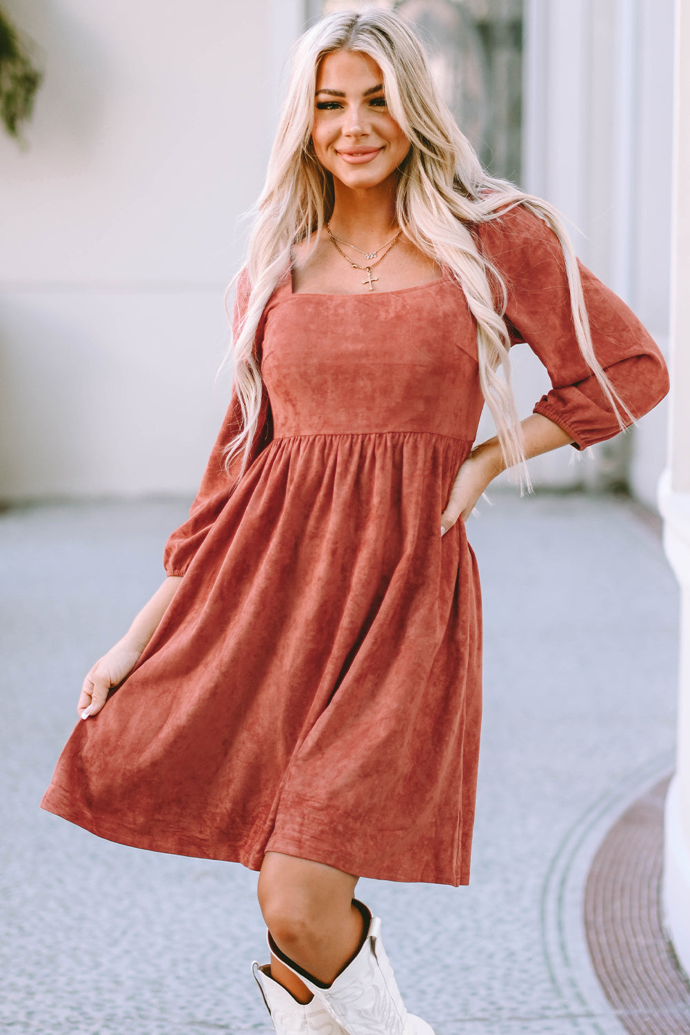 Brown suede dress with square neck and puffed sleeves