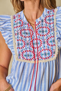 Striped fringed blouse with geometric pattern with sky blue stripes