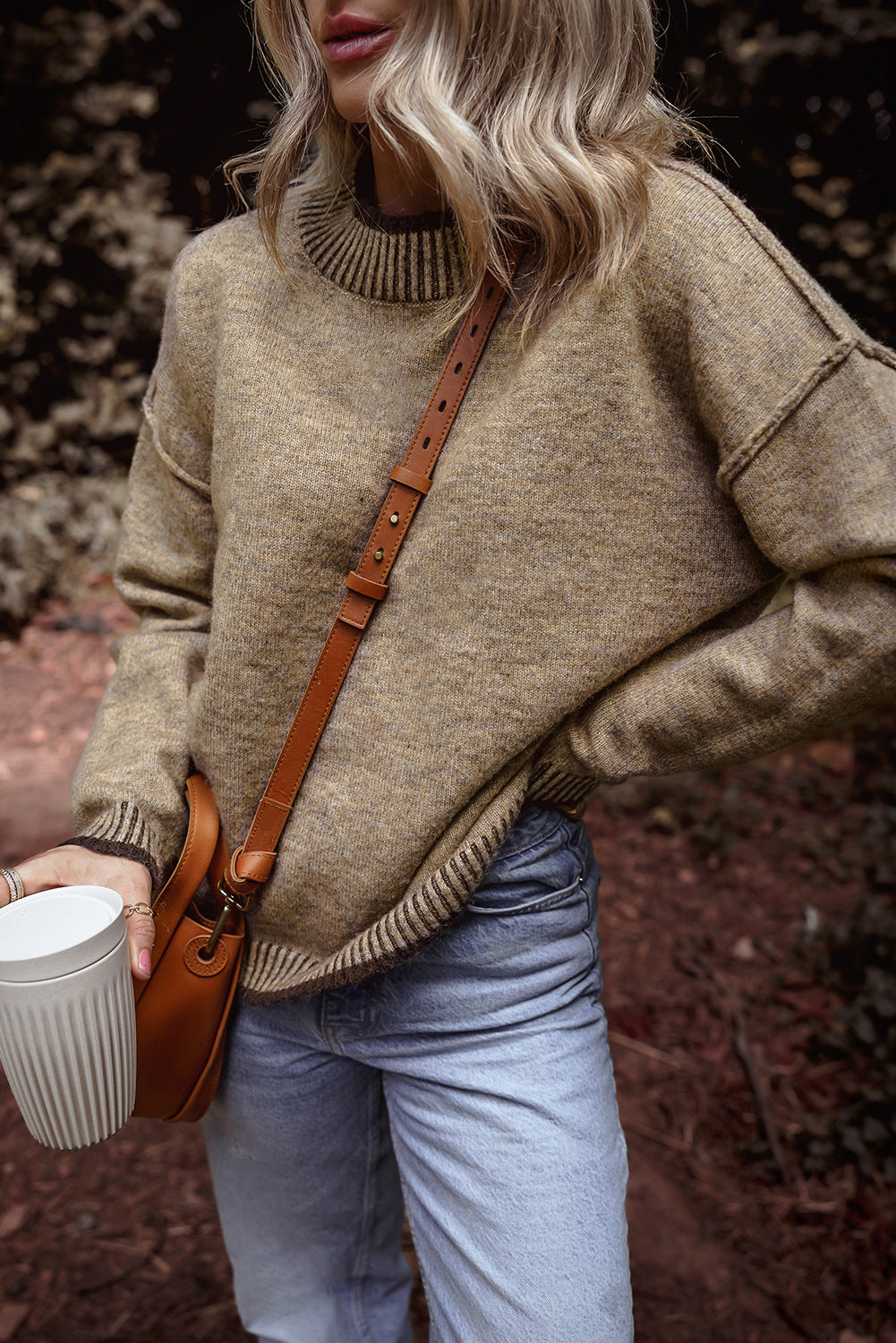 Pale khaki sweater with dropped shoulders and high neck with contrasting trim