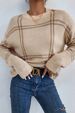 Khaki sweater with falling knitted shoulders with Scottish pattern