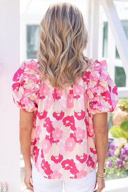 Pink flower high with split neck and puffy sleeves with ruffles