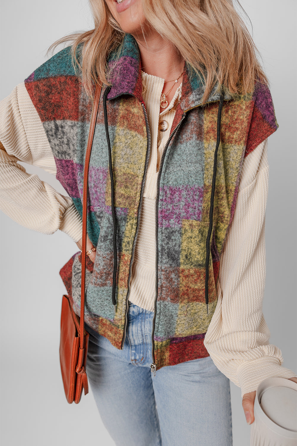 A large zipped vest with multicolored Scottish print with side pockets