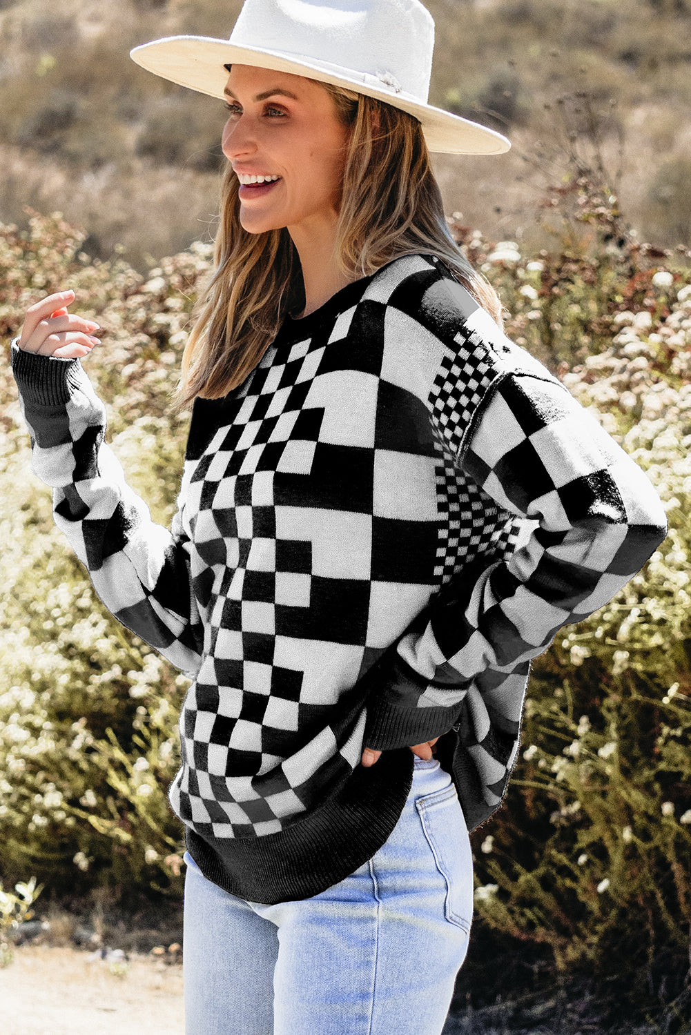 Black crew neck sweater with dropped shoulders and plaid print